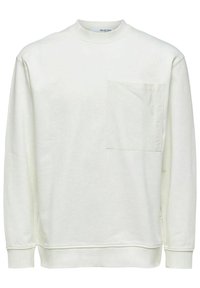 Ljuscreme sweatshirt av mjuk tyg, med rund halsringning, långa ärmar och en bröstficka på vänster sida.