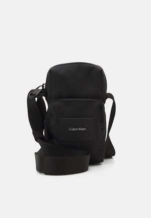 MUST REPORTER UNISEX - Bandolera - black