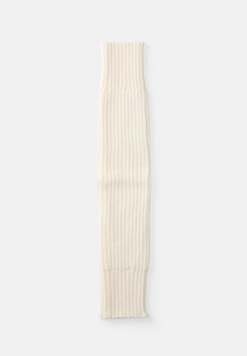 Ciorap de picior de culoare crem, cu un design tricotat texturat, având un tiv pliat la un capăt. Măsoară aproximativ 60 cm în lungime.
