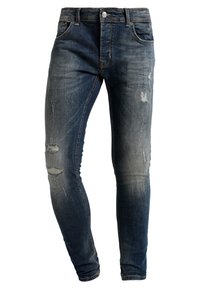 Slim-fit mörkblå denimjeans med blekta och slitna områden, försedda med knappstängning och femfickdesign.