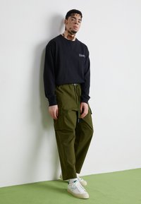 Manastash FLEX CLIMBER - Kargopüksid - oliv