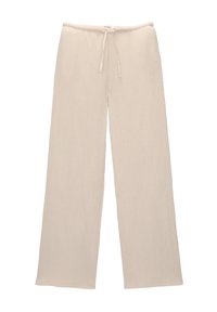 Jasbeżowe, szerokie spodnie wykonane z teksturowanej, prążkowanej tkaniny. Zawierają elastyczny pas z sznurkiem do regulacji.
