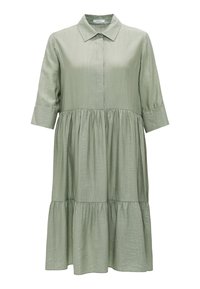 Robe verte clair jusqu'aux genoux, à volants, manches trois-quarts, col pointu et tissu subtilement texturé.