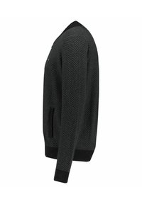 Maglione nero lavorato a maglia con un motivo testurizzato, tasche laterali e polsini e orlo a coste. Presenta un classico design con scollatura rotonda.