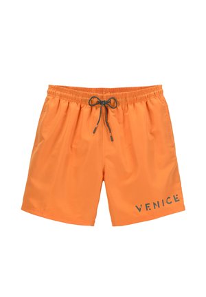 Narančaste kupaćice napravljene od laganog materijala, s elastičnom trakicom i vezicom, te natpisom "VENICE" sprijeda.