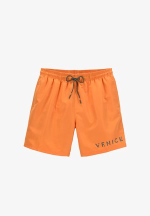 Costumi da bagno arancioni realizzati in materiale leggero, con vita elastica e cordino, e testo "VENICE" sul davanti.