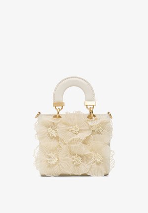 Borsa color crema con manico curvo e sei grandi applicazioni floreali di tessuto trasparente che coprono la parte anteriore.