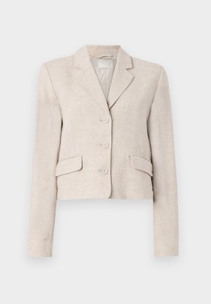 Beeži linane bleiser, millel on sobiv lõige, klapikrae, kolme nupuga kinnitamine ja kaks esikotit. Siletekstuur, millel on peen kudum.