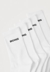 Fem par hvide bomuldssokker med ribbet struktur og sort "BORG"-logo trykt på hver sok.