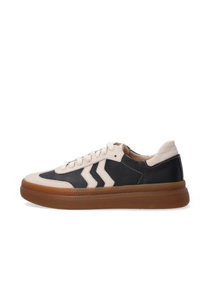 Low-top sneaker with black and beige leather upper, chevron detailing, and thick brown rubber sole, shown in side profile.