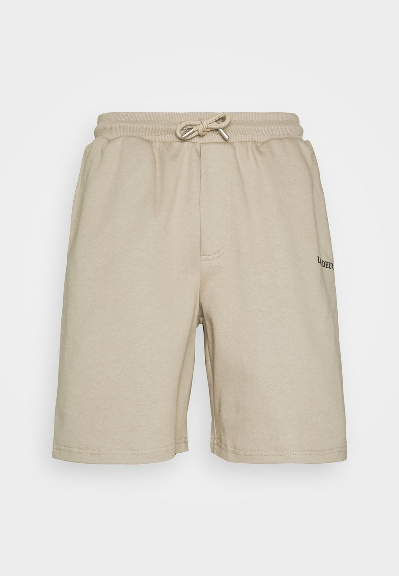 Shorts en coton beige avec une taille élastique et un cordon de serrage. Comprennent une poche avant et un discret logo sur le côté.
