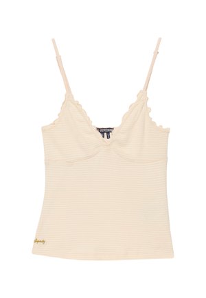 Kremowy prążkowany top na cienkich, regulowanych ramiączkach, z falistymi brzegami i wyszywanym złotym logo "Superdry" na dole.