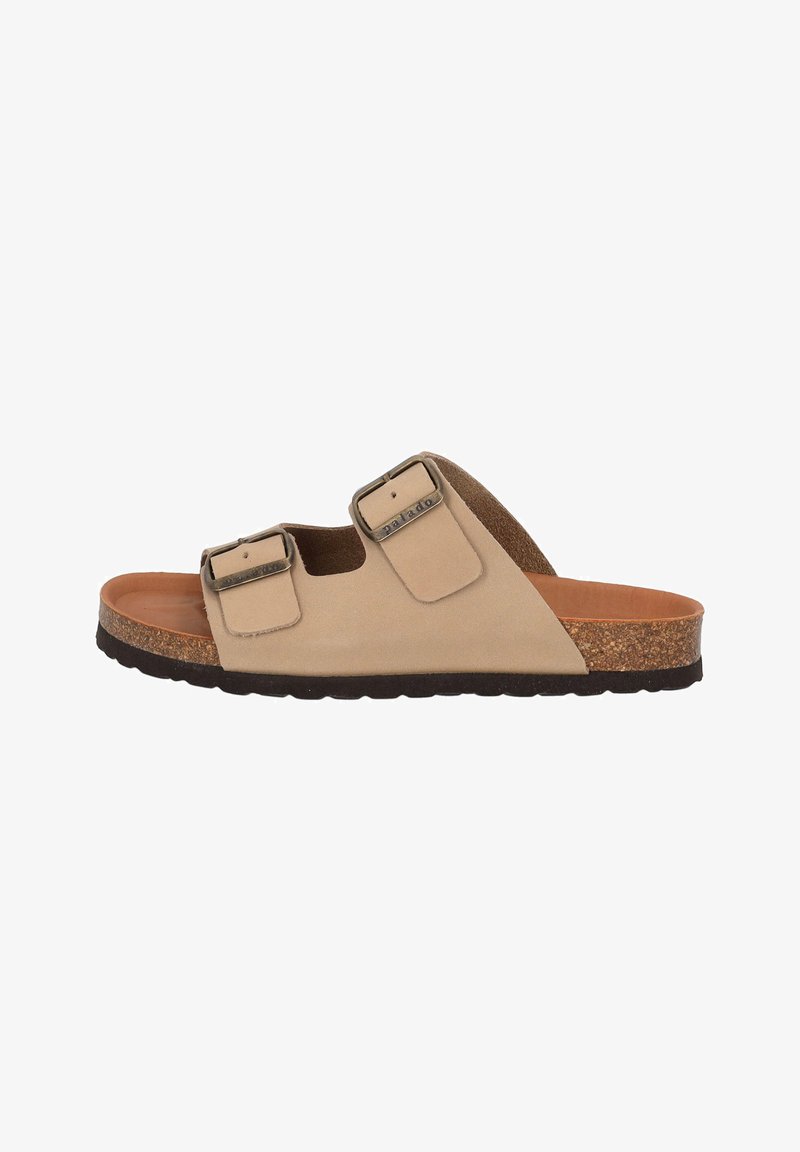 Sandal en suède beige à glisser avec deux sangles ajustables et boucles métalliques. Semelle en liège et semelle extérieure en caoutchouc texturé. Design minimaliste.