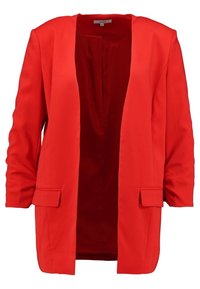 Blazer rouge en tissu lisse, avec manches longues, devant ouvert, deux poches avant et une coupe décontractée.