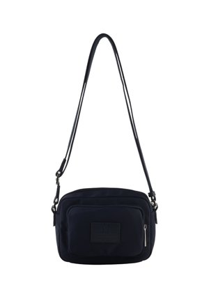 Petit sac bandoulière noir avec sangle réglable et poche avant zippée avec patch rectangulaire cousu.