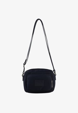 Petit sac bandoulière noir avec sangle réglable et poche avant zippée avec patch rectangulaire cousu.