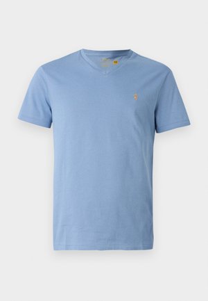 Light blue cotton t-shirt with a v-neck, short sleeves, and a small embroidered logo on the left chest. Smooth texture, casual fit.