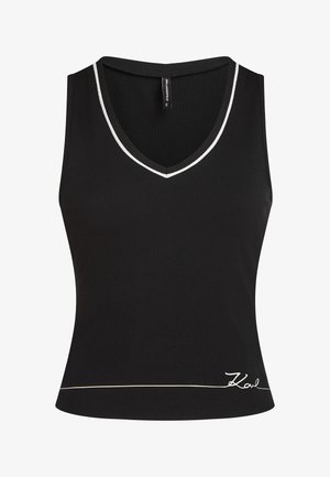 Camiseta sin mangas negra acanalada con escote en V, con un contorno blanco en el cuello y una línea de acento dorado en el dobladillo. Logotipo bordado en la parte delantera.