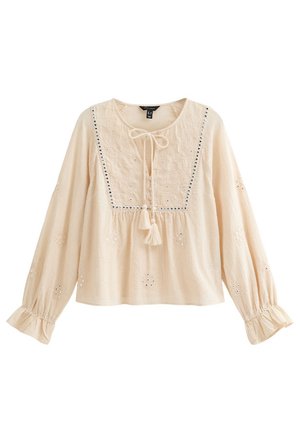 Crèmegekleurde blouse met lange mouwen, geborduurde details, een ronde hals, een trekkoord en franjeaccenten. Gathered bij de taille.