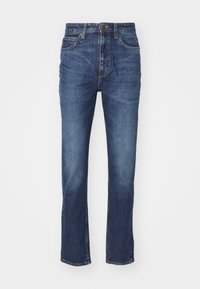 Tmavě modré džíny z denimu s rovnými nohavicemi, které mají pět kapes, knoflíkový zip a jemné vyblednutí podél stehen.