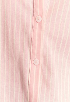 Light pink shirt featuring thin vertical white stripes, with a pointed collar and three buttons down the front, crafted from soft fabric.