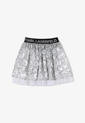 Gonna di paillettes argento con una fascia elastica nera con la scritta "KARL LAGERFELD." Sottogonna in tulle a strati che aggiunge volume. Design svasato.