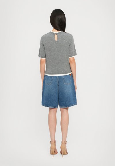 Gray short-sleeve top with white trim and a keyhole back, paired with knee-length blue denim shorts. Smooth fabric, casual design.