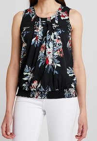 Black floral blouse with sleeveless design, featuring pleats, a gathered hem, and multicolored floral patterns against a dark background.