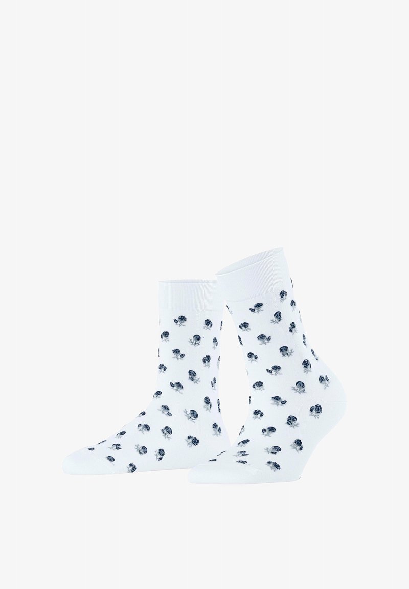 Chaussettes montantes blanches avec un motif répétitif de petites coccinelles noires et bleues dispersées de manière régulière sur le tissu.