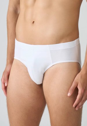 Mutander bianchi da uomo realizzati in tessuto morbido, con un'ampia cintura e una tasca frontale sagomata per supporto.