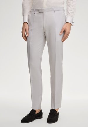 - Spodnie materiałowe