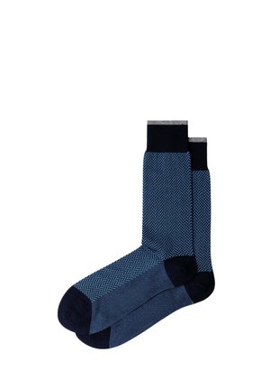 Pair of blue patterned crew socks with navy toe, heel, and cuff, featuring a subtle chevron design on the main body.