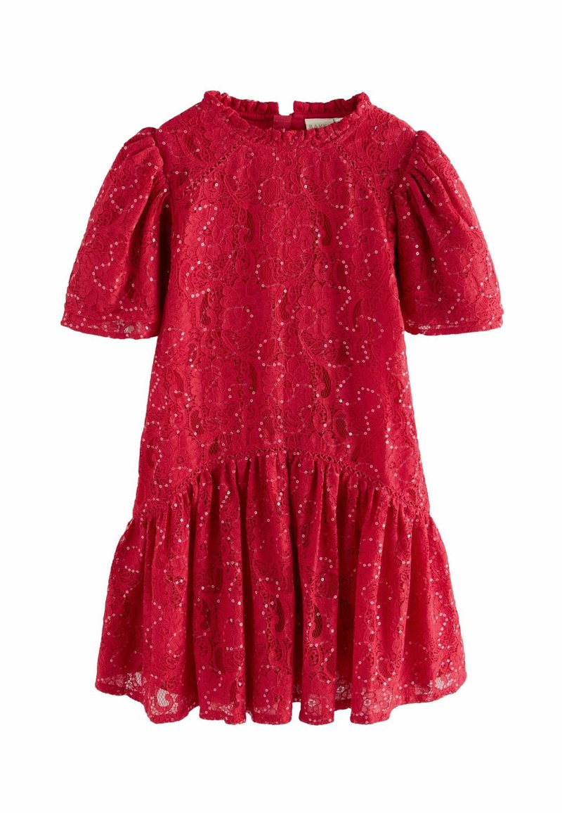 Czerwona koronkowa sukienka z krótkimi bufiastymi rękawami, wysokim dekoltem i rozkloszowanym dołem z marszczonym wykończeniem. Iskrzące się cekiny stanowią ozdobę.
