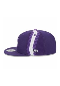 Purple baseball cap with a flat brim, featuring white and lighter purple stripes, and a logo on the front. Textured fabric.