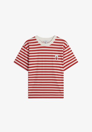 Czerwono-kremowa w paski bawełniana koszulka z krótkim rękawem, z małym logo płomienia na lewej piersi i okrągłym dekoltem. Luźny krój.