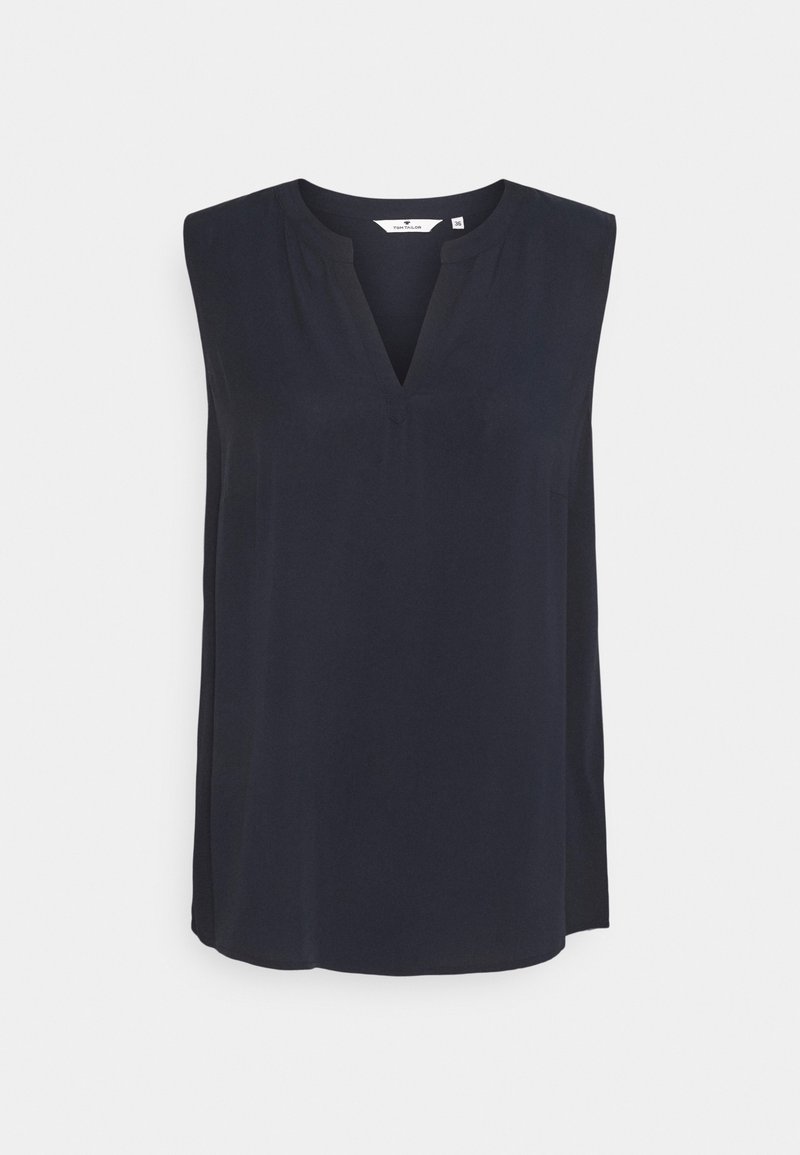 Marinblus utan ärmar med V-ringning, tillverkad av lättviktsmaterial. Har en avslappnad passform och en slät yta. Inga synliga mönster eller detaljer.