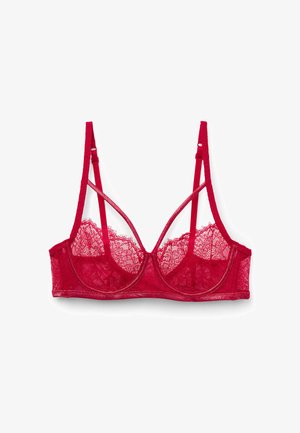 Red lace bralette featuring adjustable straps, mesh cups, and a sheer back. Intricate lace pattern with a soft, textured finish.