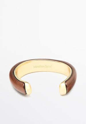 Open-ended cuff bracelet with polished brown resin exterior and gold-tone metal interior engraved with "Massimo Dutti."