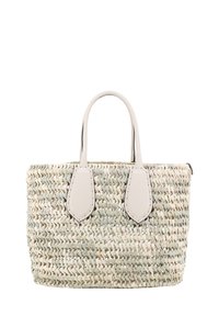 Woven straw tote bag with light beige and pale green tones, featuring two white leather handles and an open top design.