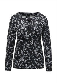 Zwart langarm T-shirt met een bloemig en abstract patroon in grijs en wit, met een ronde hals en een strikdetail aan de voorkant.