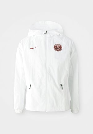 Witte windbreaker jas met een capuchon, voorzien van een bordeauxrode PSG-logo op de linkerborst, ritssluiting zijzakken en elastische manchetten.