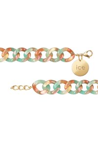 Daudzkrāsains ķēdes aproce ar gludām, caurspīdīgām saitēm piparmētru zaļā un persiku krāsā, ar zelta sprādzi un logo birku.