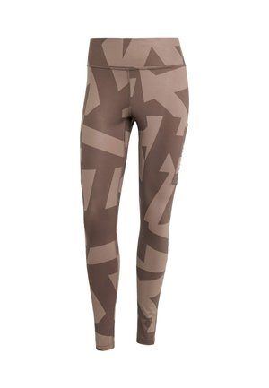 Bruine leggings gemaakt van rekbaar materiaal met een abstract patroon in verschillende bruine tinten. Hoge tailleband met zijzakdetail.