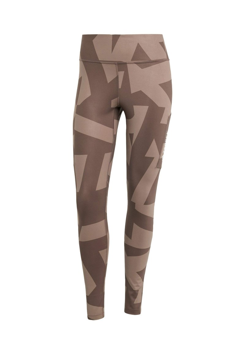 Leggings marroni realizzati in materiale elasticizzato con un motivo astratto in diverse tonalità di marrone. Vita alta con dettagli delle tasche laterali.