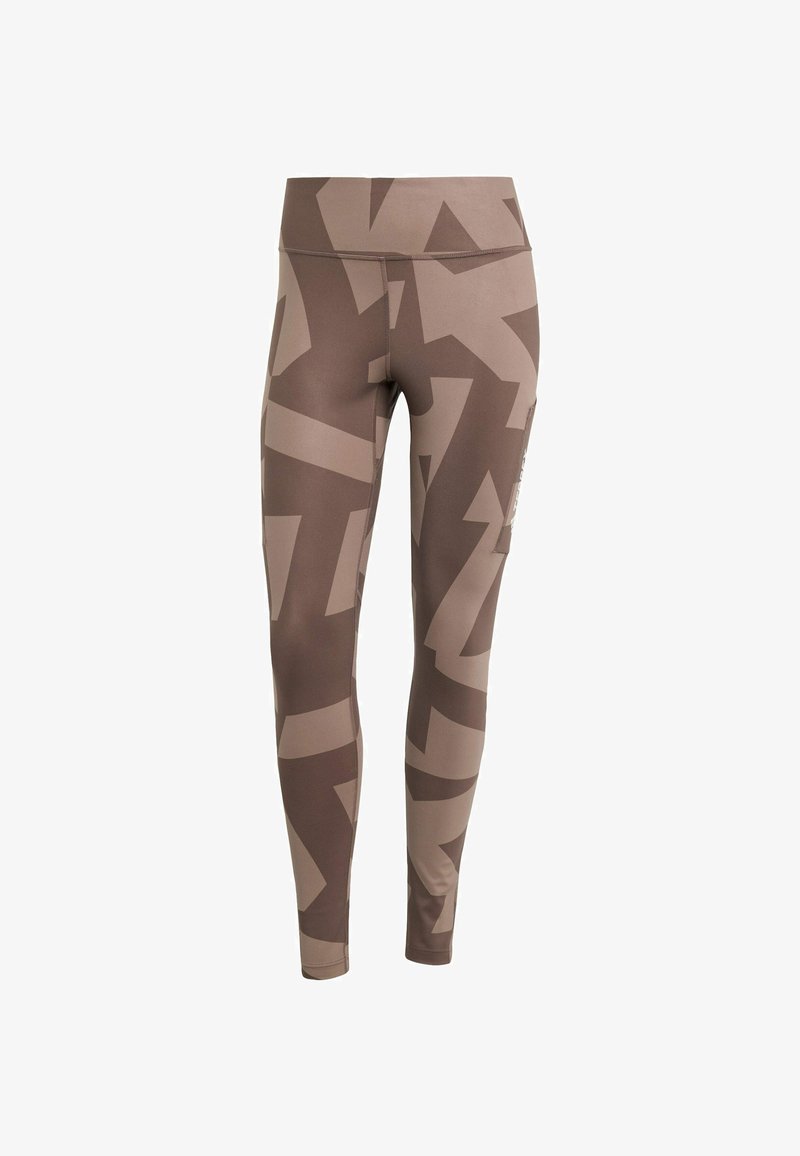 Leggings marroni realizzati in materiale elasticizzato con un motivo astratto in diverse tonalità di marrone. Vita alta con dettagli delle tasche laterali.