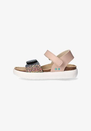 Pink leather sandals feature a glittery strap, adjustable Velcro closure, cork footbed, and a white rubber sole with blue accents.