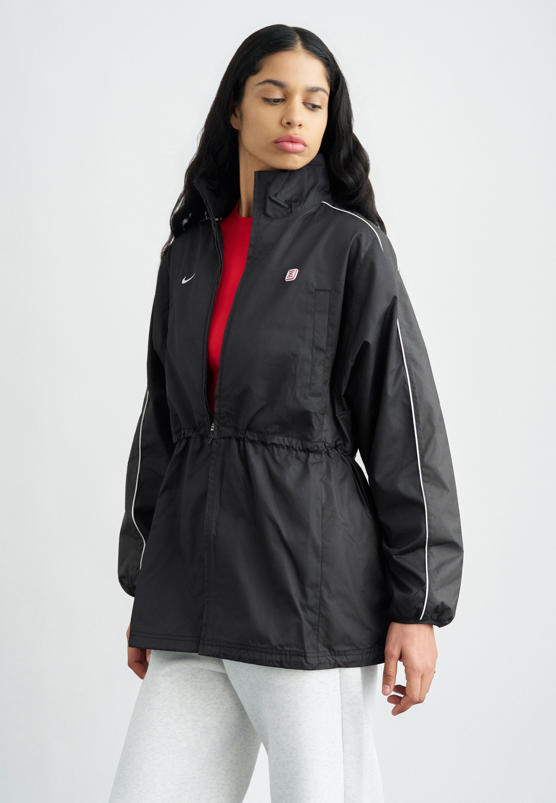 black nike windbreaker with white stripes