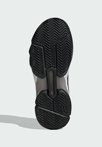 Suela de zapato de goma negra con un patrón de tracción multidireccional, entresuela lisa y un diseño elegante y ergonómico con acentos en gris y blanco.