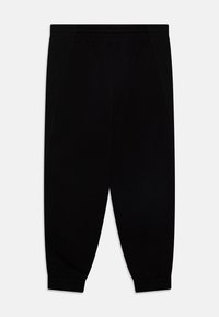 Black sweatpants made from soft fabric, featuring a tapered leg design, elastic waistband, and ribbed cuffs at the ankles.