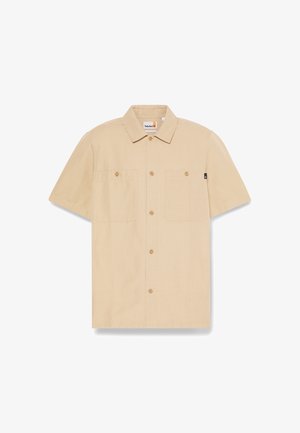 Beige short-sleeve button-up shirt with two chest pockets and collar, Timberland label inside collar and small black side tag.